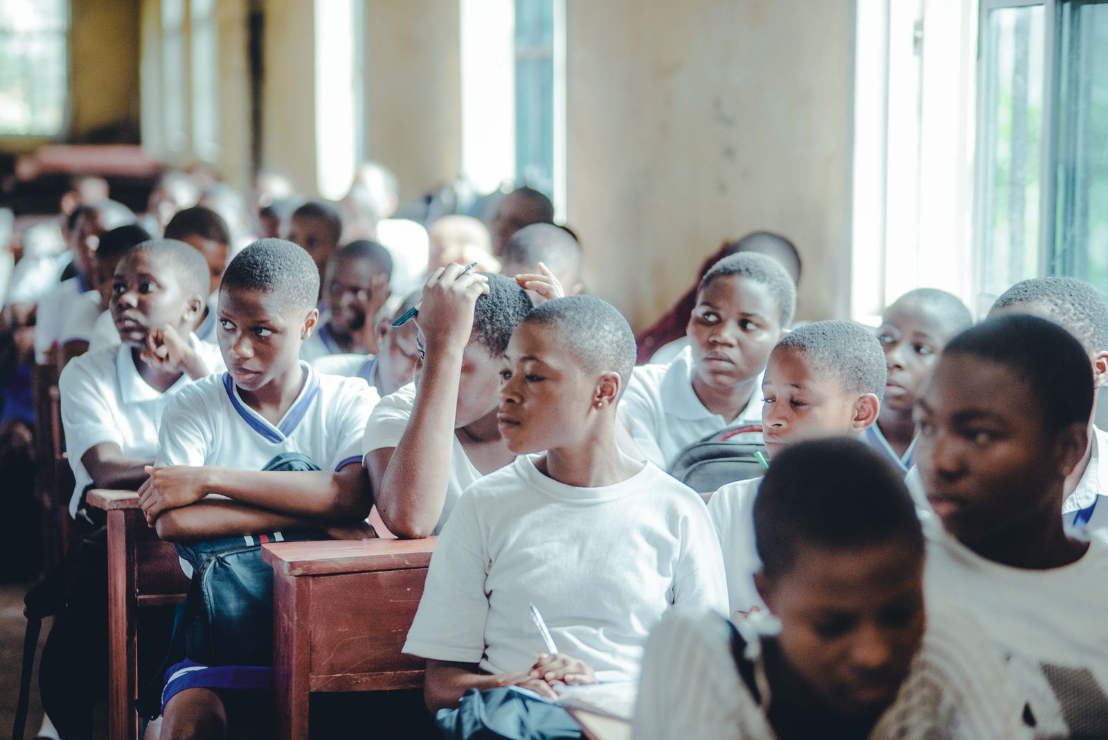 Students attentively participating in a classroom lecture
